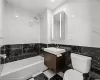 Full bathroom featuring shower / bathtub combination, tile walls, toilet, and vanity