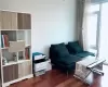 Living area featuring dark wood-type flooring