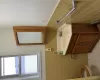 Bathroom featuring tile patterned flooring, vanity, tile walls, and toilet