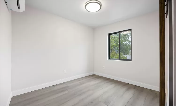 Empty room featuring light hardwood / wood-style flooring