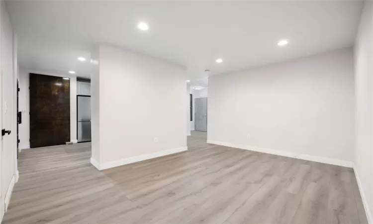 Spare room featuring light wood-type flooring