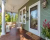 Wooden terrace featuring covered porch and ceiling fan