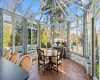 Sunroom / solarium with a notable chandelier