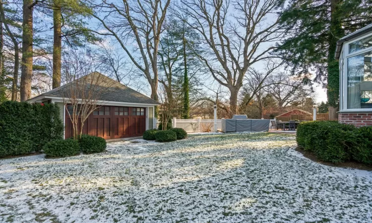 View of yard with a garage