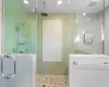 Bathroom featuring tile walls and walk in shower