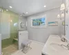 Bathroom with a shower with door and vanity