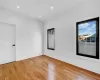 Unfurnished room featuring light wood-type flooring and cooling unit