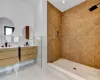 Bathroom featuring tile walls, toilet, a tile shower, and french doors