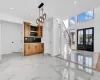 Kitchen featuring tasteful backsplash, a kitchen island, and stainless steel refrigerator