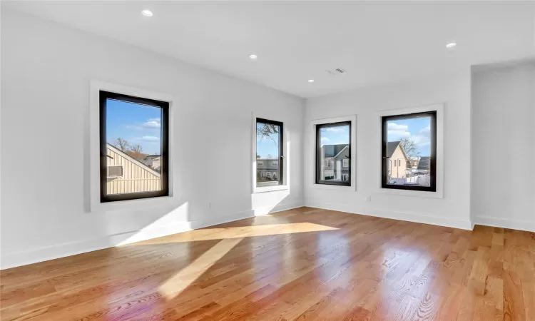 Unfurnished bedroom with light wood-type flooring