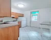 Kitchen featuring sink and white appliances