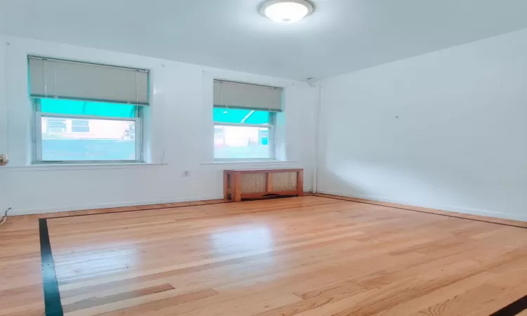 Empty room with light wood-type flooring