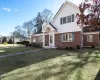 View of property with a front yard