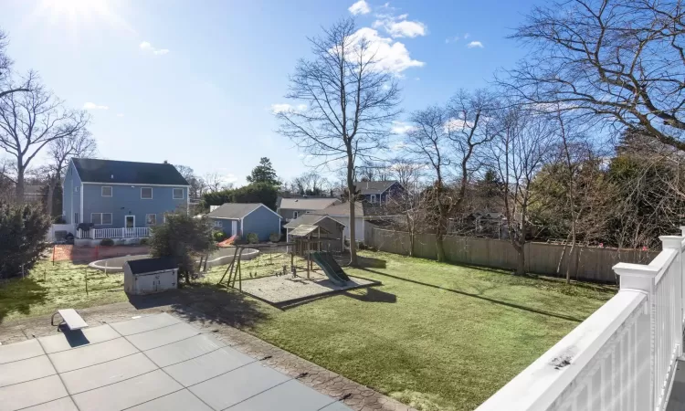 View of yard with a patio, a playground, and a trampoline