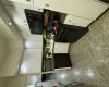 Kitchen with backsplash, stove, dishwasher, white cabinets, and sink