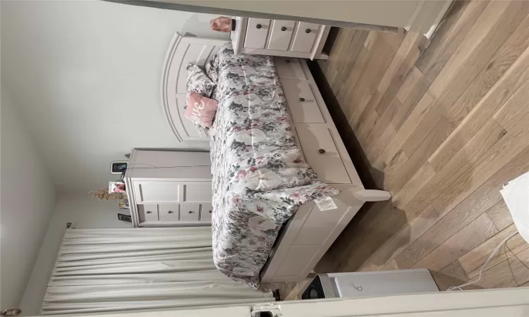 Bedroom featuring hardwood / wood-style flooring