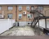 Back of property featuring a wall mounted AC