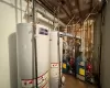 Utility room featuring gas water heater