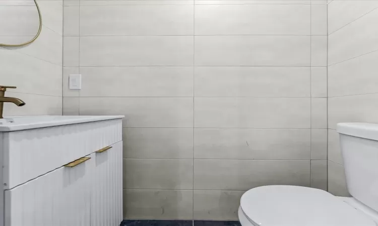 Bathroom with toilet and vanity