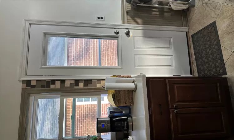 Bathroom with backsplash, toilet, and vanity