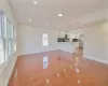 Unfurnished living room featuring light wood-type flooring