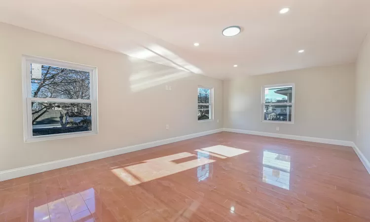 Unfurnished room with hardwood / wood-style flooring