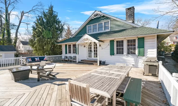 Wooden terrace with grilling area and french doors