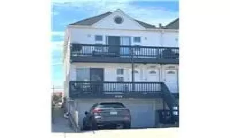 View of front facade featuring a garage