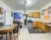 Kitchen featuring backsplash, sink, gas stove, and light hardwood / wood-style floors