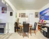 Dining area with a fireplace and light wood-type flooring