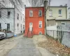 View of front of property with cooling unit