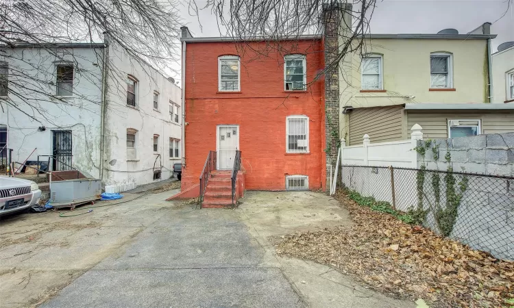 View of front of property with cooling unit