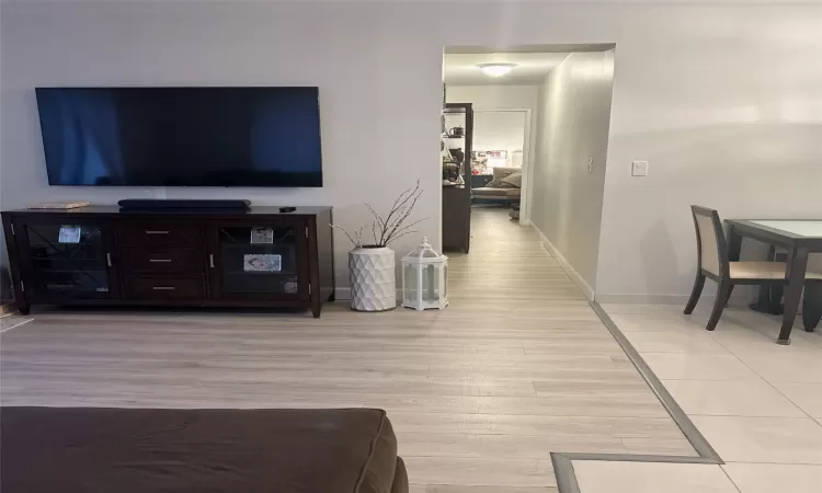 Living room with light wood-type flooring