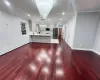 Kitchen with kitchen peninsula, sink, an inviting chandelier, hanging light fixtures, and white cabinets