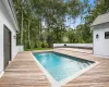 View of swimming pool featuring a deck