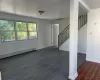 Unfurnished living room with dark hardwood / wood-style floors and a baseboard radiator