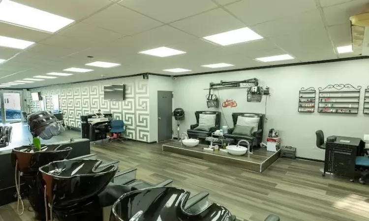 Gym featuring a paneled ceiling and hardwood / wood-style flooring