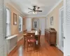 Dining room with ceiling fan, crown molding, and hardwood / wood-style floors