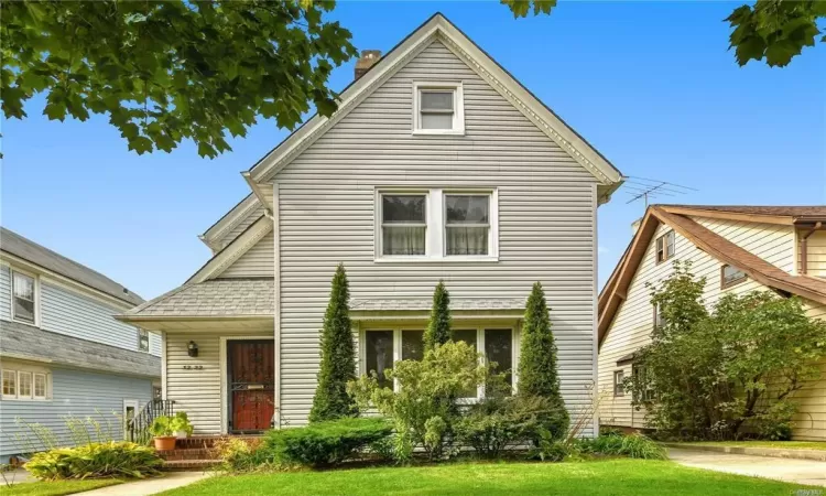 View of property featuring a front yard