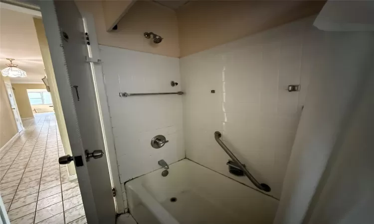 Bathroom with shower / bath combination and tile patterned floors