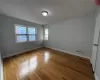 Empty room with hardwood / wood-style flooring