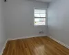 Spare room with hardwood / wood-style floors