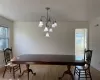 Dining room featuring hardwood / wood-style floors and a notable chandelier