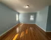 Unfurnished room with dark hardwood / wood-style floors