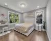 Bedroom with hardwood / wood-style flooring