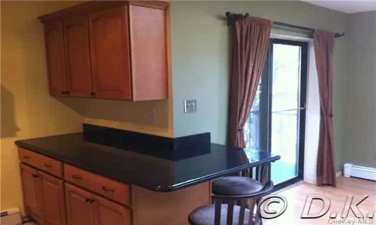 Kitchen featuring a baseboard heating unit