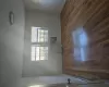 Unfurnished room with baseboard heating and dark wood-type flooring