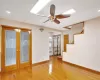 Spare room with radiator, french doors, and hardwood / wood-style floors