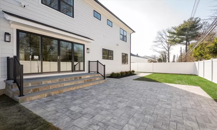 Rear view of house featuring a patio