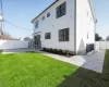 Back of house featuring a fully fenced yard and a patio